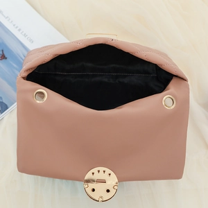 Chic quilted crossbody bag in soft pink with golden rotating lock shown from top view