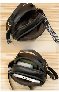 Vue détaillée du sac bandoulière noir avec double fermeture éclair et grand rangement
