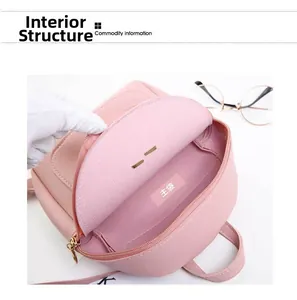 Internal structure showing the main pocket of the pink leather backpack with gray lining