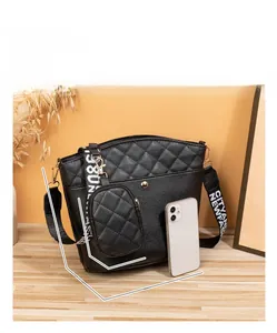 Quilted black bucket bag set with 26cm size detail and decorative ribbon strap