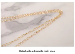 Close-up of detachable and adjustable golden metal chain strap with metal hooks