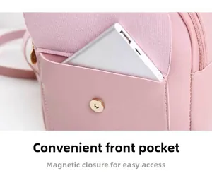 Detail of pink leather backpack featuring a front pocket with magnetic closure for easy access