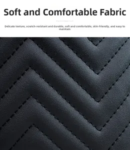 Macro view of black V-quilted leather fabric showing anti-scratch and wear-resistant texture