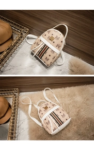 Detail of mini leather backpack featuring vintage digital prints and tri-color stripes