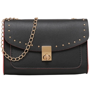 Black pebbled leather crossbody bag with gold rivets, chain strap and red edge detail
