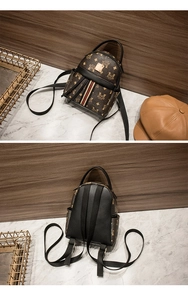 Close-up of mini brown monogram backpack with striped webbing and golden metal logo