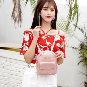 Chic pink leather mini backpack with metal logo and front pocket for women