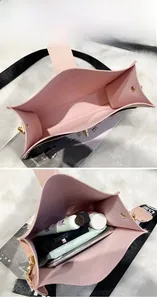 Vue détaillée de l'intérieur du sac seau rose avec compartiments et sangle large