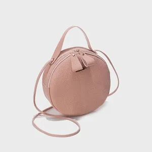 Sac bandoulière rond rose à texture litchi avec poignée et double fermeture éclair