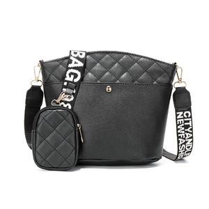 Black quilted bucket bag set with wide woven strap and small coin pouch in matte PU leather