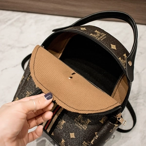 Vintage dark brown leather backpack with digital letter prints and golden zipper detail