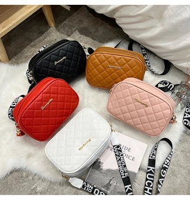 Group of quilted crossbody camera bags in five colors with wide graphic straps