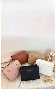 Selection of chic mini square bags with cheese hole cutouts in five versatile colors