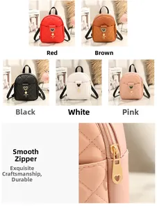 Detailed view of quilted backpack featuring golden heart zippers and cute character charm