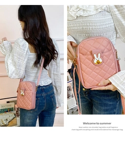 Pink quilted mini crossbody bag featuring a cute white rabbit hardware buckle and strap