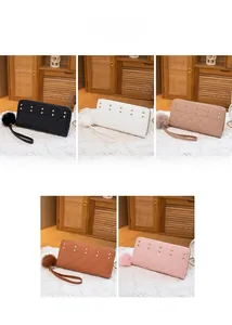 Quilted long wallets with golden rivets and pompom charms in five elegant colors