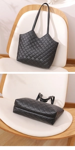 Detail view of black quilted tote bag with spacious interior and wide bottom structure