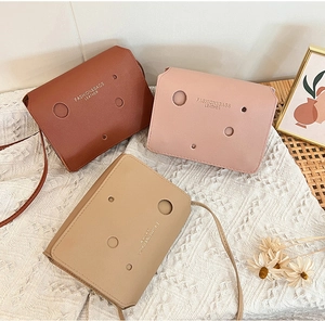 Three-color leather mini bags with unique cheese-hole design and branding detail