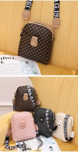 Detail of multi-color retro patterned crossbody bags with wide fabric logo straps