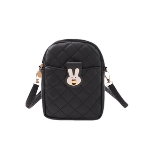 Quilted black crossbody bag with rabbit hardware and long shoulder strap on white background