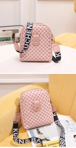Detail of pink crossbody bag with geometric pattern and wide woven canvas strap