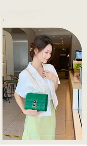 Detailed view of green quilted leather chain bag featuring gold metal push-lock closure