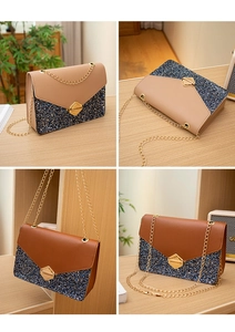 Close-up of glitter patchwork flap bag with gold hexagon twist lock and metal chain strap
