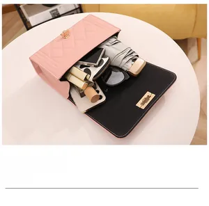 Top view of pink quilted bag showing large interior space for phone and wallet