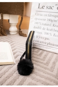 Glossy black long wallet with matching faux fur pom-pom charm and gold metal zipper