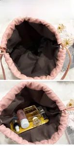 Detailed interior of a pink lychee textured bucket bag showing large storage capacity