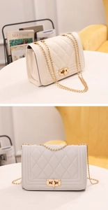 Close-up of quilted chain bags in cream and grey with gold hardware and turn-lock