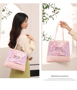 Detail view of pink holographic tote bag with Little Beauty text and vegan leather handles