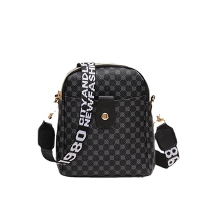 Vintage geometric print crossbody bag with black leather buckle and wide web strap
