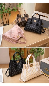 Detail of elegant handbags with circular patterns and gold metal turn-lock closures