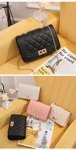 Close-up of quilted shoulder bags with gold chain straps and metal push-lock fasteners