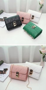 Detailed view of quilted chain bags with metal twist locks in black, pink, white and green