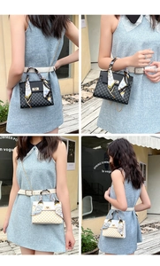 Detail of elegant printed handbag featuring a silk scarf handle and golden twist lock