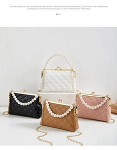 Detailed view of quilted faux leather wallets with pearl handles and gold chain straps