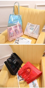 Close-up of Little Beauty holographic tote bags in blue, pink, and white glossy finishes