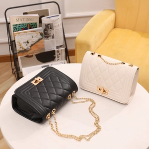 Classic quilted shoulder bag in black and white with gold chain and square lock