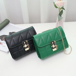 Minimalist quilted crossbody bag in black and green colors with gold chain strap