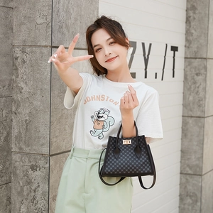 Classic black monogram satchel bag with gold lock and adjustable strap for women