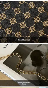 Detail of black pebbled leather texture with gold clover pattern and thick metal chain