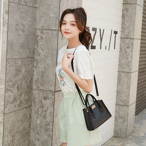 Chic black tote bag with gray checkerboard pattern and gold buckle for women