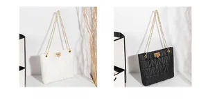 Detail of white and black quilted chain shoulder bags with golden leaf lock closures