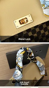 Macro shot of gold metal twist lock and silk scarf wrapped handle on women's handbag