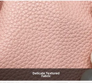 Macro shot of fine textured lychee grain leather in soft pink for women fashion handbag