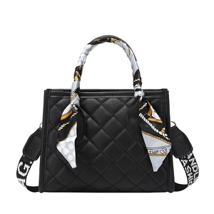 Classic black quilted handbag with silk scarf handle and adjustable fashion strap