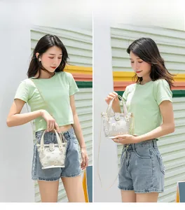 Sac à main transparent en PVC avec fleurs de marguerite et bandoulière en chaîne métallique