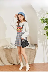 Litchi pattern black leather handbag styled with an autumn casual women outfit